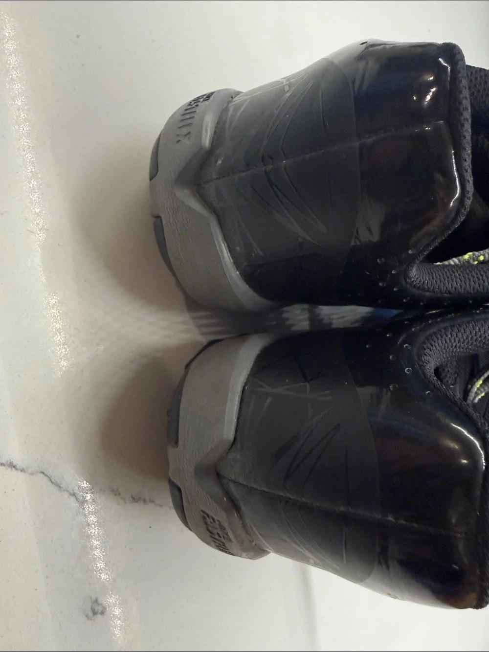 Nike Gray Cleats with White Swoosh and Neon-Lime Accents